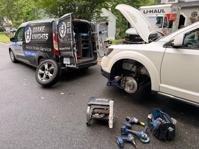 Brake Knights service van with tools at a job site